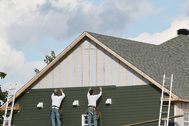 Professional Siding Installation technician working in Island Park, NY